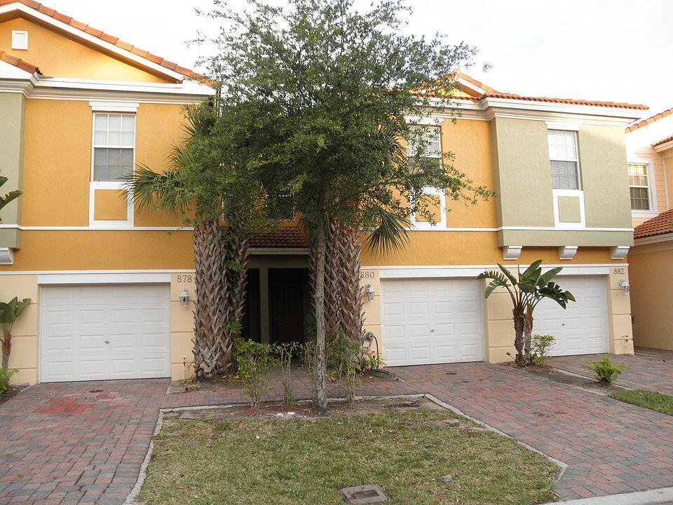 Photo of 880 Pipers Cay Drive, West Palm Beach, FL 33415 (MLS # B26043451)
