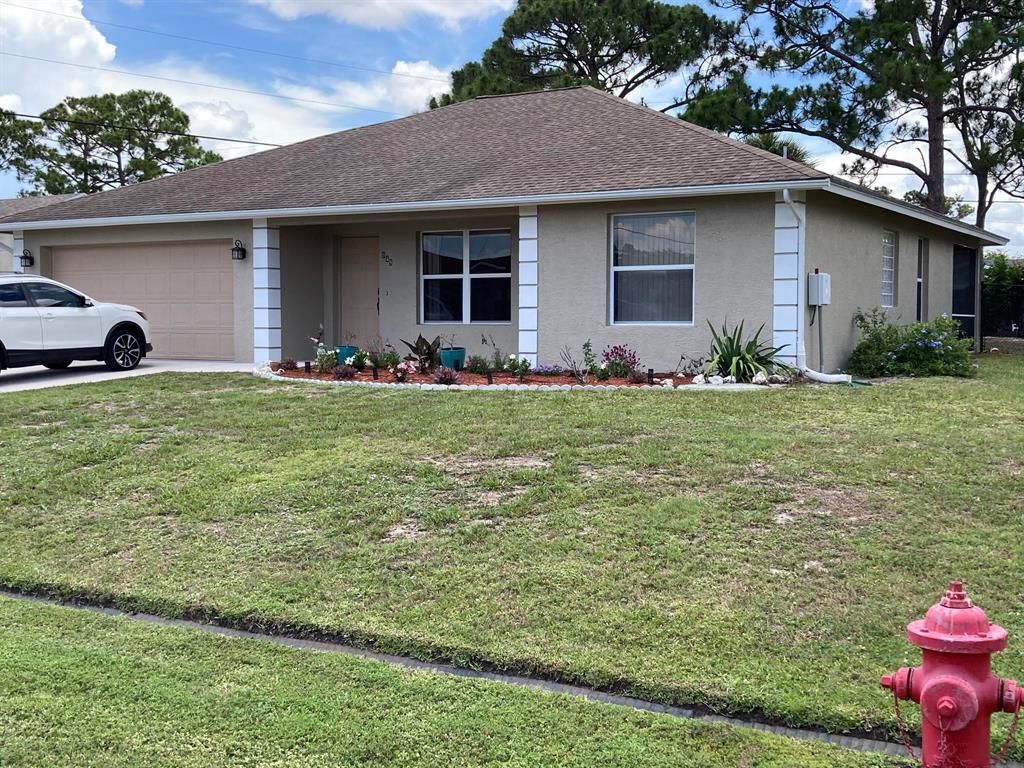 Photo of 949 SW Longfellow Road Rd, Port St Lucie, FL 34953 (MLS # R10804084)