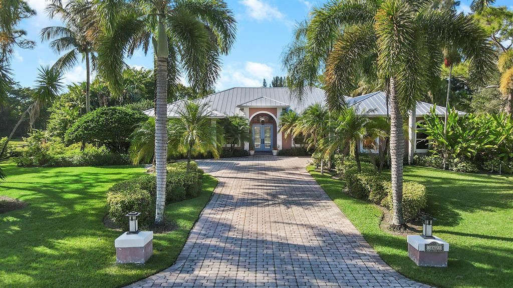 Photo of 8621 Man O War Road, Palm Beach Gardens, FL 33418 (MLS # R10763474)