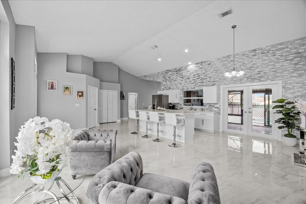 Photo of 471 NW Sherbrooke Avenue, Port Saint Lucie, FL 34983 (MLS # B26011778)
