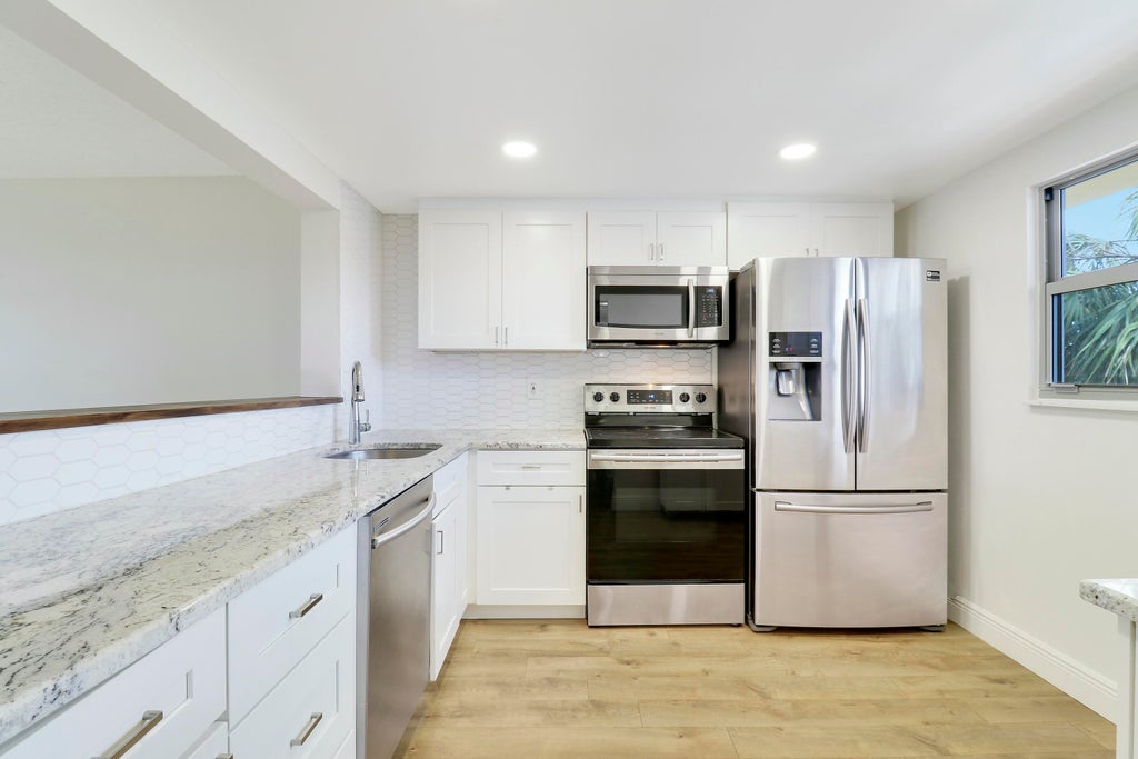 Photo of 3755 Via Poinciana #309, Lake Worth, FL 33467 (MLS # R11077928)
