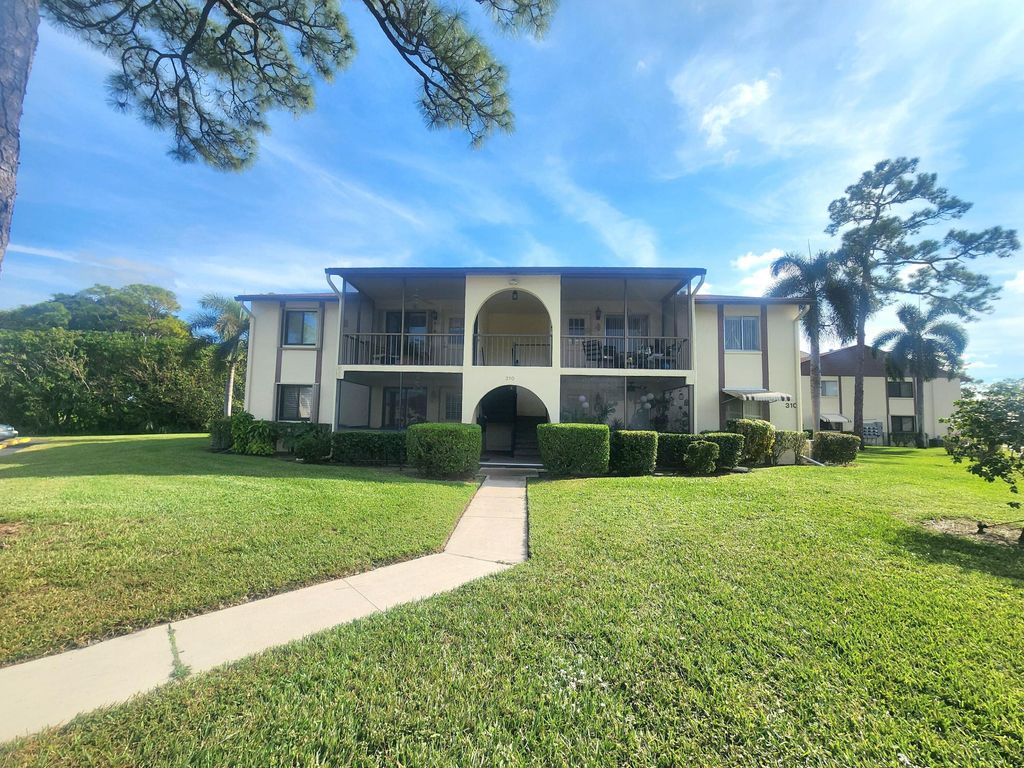 Photo of 310 Knotty Pine Circle #D-2, Greenacres, FL 33463 (MLS # R11146611)