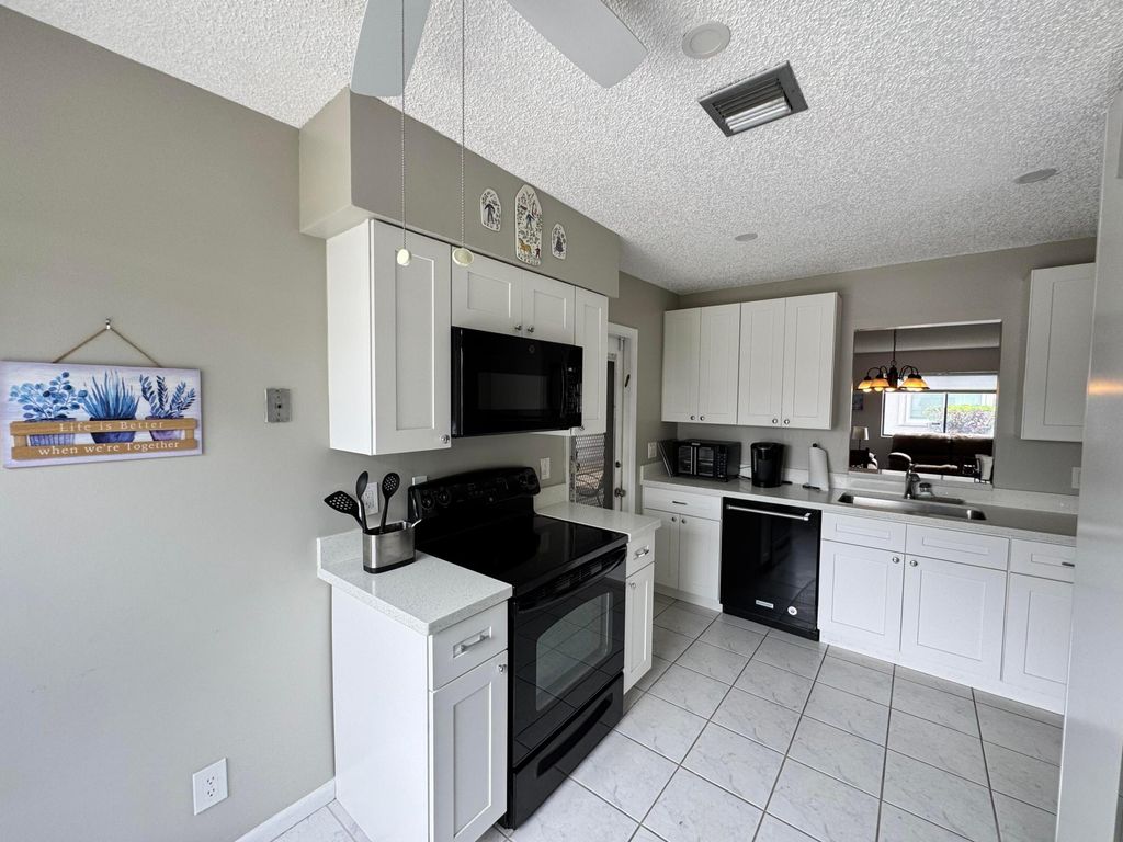 Photo of 14822 Wildflower Lane, Delray Beach, FL 33446 (MLS # B26009942)