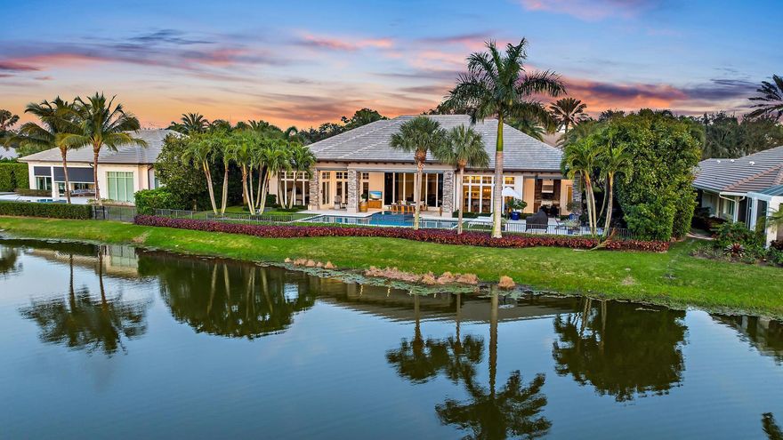 An exquisite residence nestled within the prestigious gated enclave of Old Marsh Golf Club in Palm Beach Gardens, FL. This exceptional single-story home, custom-built in 2015, offers an unparalleled blend of elegance and comfort, set against the backdrop of breathtaking lake and golf course views.  This meticulously maintained property boasts four spacious bedrooms, five and a half luxurious bathrooms, and a well-appointed office with French doors that open to a stunning outdoor living area.The heart of the home is the great room, where expansive views are celebrated and seamlessly integrated with the outdoors through sliding glass doors and electronic screens, creating a harmonious indoor-outdoor living experience.The outdoor oasis is a masterpiece of...more