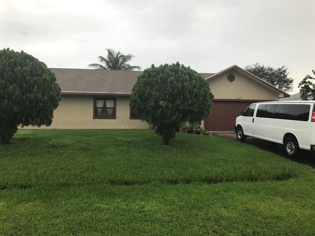 Photo of 1671 SW Mistletoe Street, Port Saint Lucie, FL 34953 (MLS # R10676787)
