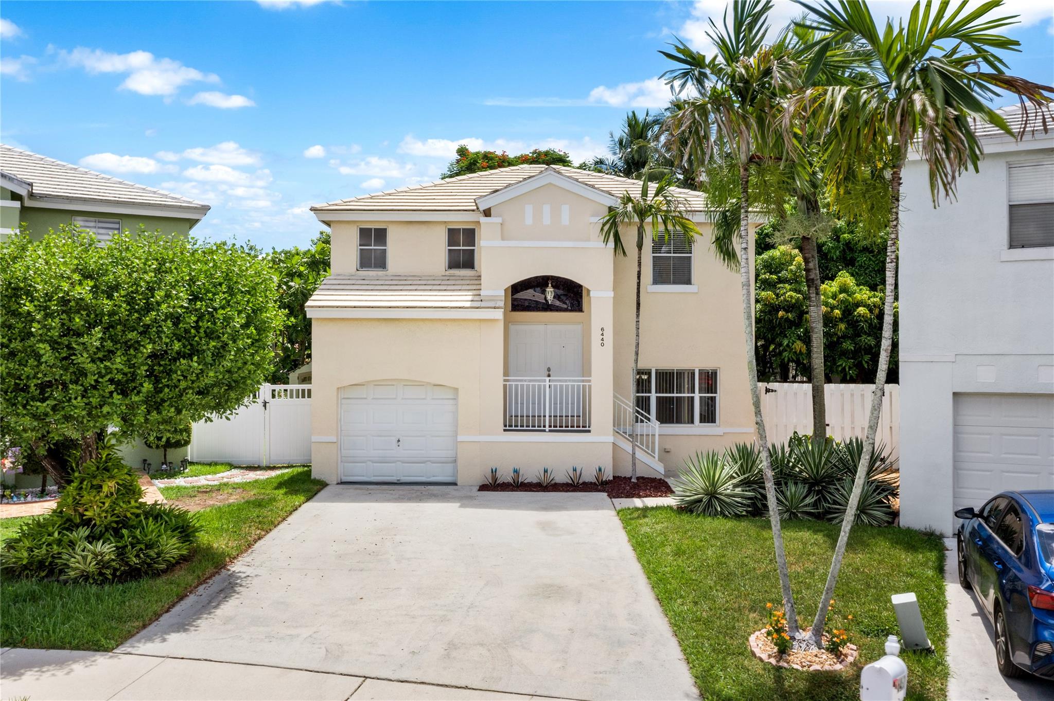 Welcome to one of the largest lots in The Cape at Coral Bay! This single-family home features a rare oversized driveway for 4 cars, plus a 15x15 screened patio. The expansive backyard is a tropical retreat with banana and mango trees, coconut palms perfect for a hammock and beautiful Christmas & fishtail palms that add charm and character. There’s plenty of room for entertaining, a future pool or an outdoor kitchen, no compromises here! Inside, enjoy fresh paint, brand-new upstairs Lifeproof vinyl floors and abundant natural light. Coral Bay a gated community offers 3 pools, playgrounds, an outdoor fitness park, and more all with an incredibly low $155/year HOA.