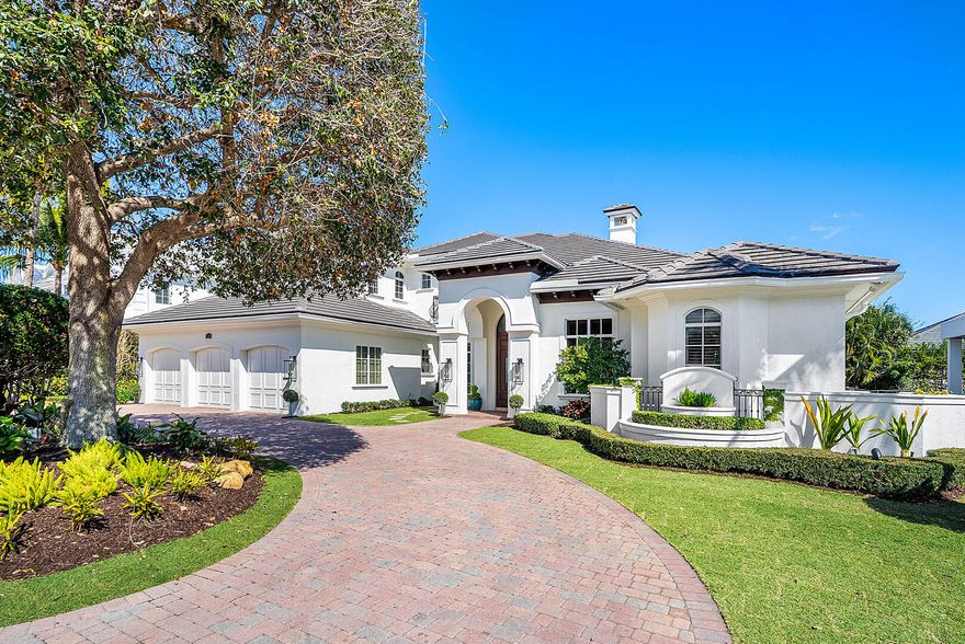 Situated within the prestigious Royal Palm Yacht & Country Club, this refined two-story residence offers over 5,000 square feet of thoughtfully curated living across five bedrooms, designed for both grand entertaining and everyday ease. A spacious, open floor plan unfolds with warmth and intention, recently refreshed with rich wood floors, custom trim, and carefully selected lighting that brings a timeless, tailored feel to every room.
The heart of the home is a chef's kitchen built to impress, featuring an expansive center island, premium appliances, a walk-in pantry, and a dedicated beverage center with wine refrigeration. Living and dining spaces flow seamlessly to the covered patio, where retractable screens, dining space, and lounge seating overlook a private backyard retreat complete with a custom heated pool and raised spa.
A private study with custom wood built-ins provides a quiet workspace, while the first-floor primary suite serves as a true sanctuary, offering a spa-inspired bath and generous his-and-her walk-in closets. Upstairs accommodations are well-proportioned and private, ideal for family and guests alike.
Additional features include natural gas, brand-new A/C systems, an elevator, a first-floor guest suite, and full impact glass and doors ensuring comfort, efficiency, and peace of mind. Positioned in one of Boca Raton's most sought-after communities, this home delivers a rare combination of scale, craftsmanship, and lifestyle-driven design.