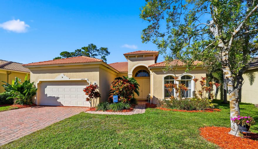 Beautiful and well-maintained CBS 3-bedroom, 2-bath home w/ a 2-car garage in the manned gated community of Portofino Shores. With 1,766 sq ft of bright, open living space and vaulted ceilings, the layout feels larger than expected and offers more space than many homes in this price range. The spacious kitchen opens to the main living area with a breakfast bar, creating an easy flow for everyday living and entertaining. The primary suite features dual sinks, a soaking tub, and walk-in closets. A 2020 A/C system adds peace of mind and helps reduce near-term maintenance concerns. Step outside to a covered, extended paver patio overlooking the backyard, perfect for relaxing or hosting. This move-in ready home has been well cared for and offers a clean, comfortable vibe.