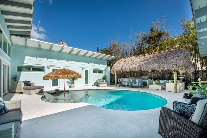 Gorgeous, 100% rebuilt, home in sought after Hillsboro Shores beach community of Pompano Beach. Home includes a primary bedroom/casita w/ complete full-size kitchen & appliances, sitting area, eat at bar, full size W/D, & pass through to tiki/pool area. Main living area: custom kitchen that includes built in Miele coffee station, warming drawer & ice machine. The living room opens w/ massive sliding doors to the tiki/pool area. The home is set up for interior & exterior flow-through entertaining. Two ensuite bedrooms, a cabana bath & additional full-size W/D make up the north section of the home. Natural gas throughout includes both dryers, tankless water heaters, heated & salt system pool, and full house generator. Private beach access w/ optional HOA membership. This is a MUST SEE home! Primary Kitchen Appliances: KitchenAid refrigerator, build in oven, convection microwave, dishwasher, natural gas cooktop, icemaker, warming drawer. Miele coffee machine. LG w/d. Custom wood & cherry cabinets. Quartz countertop.Secondary Kitchen Appliances: KitchenAid refrigerator, natural gas range, microwave, dishwasher. LG w/dPlantation Shutters throughout. Living room drapes. Mini split systems throughout. Water: Reverse osmosis systemImpact windows and doors throughout