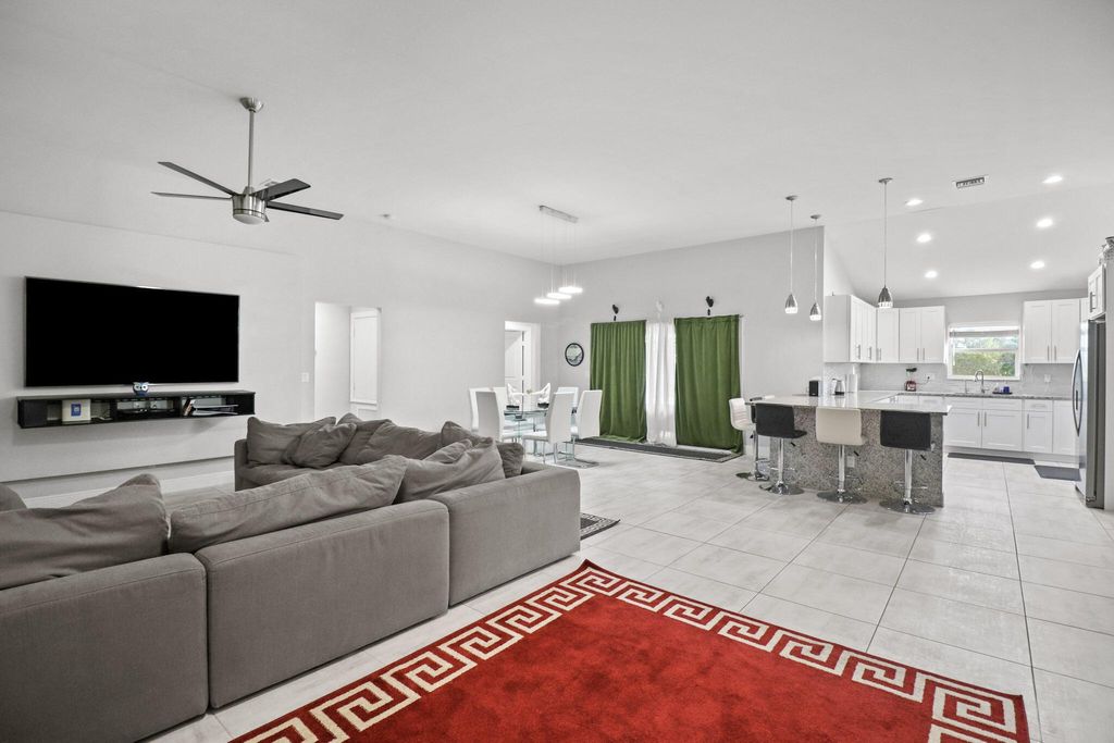 Photo of 115 SW Glenwood Drive, Port Saint Lucie, FL 34984 (MLS # R10997607)