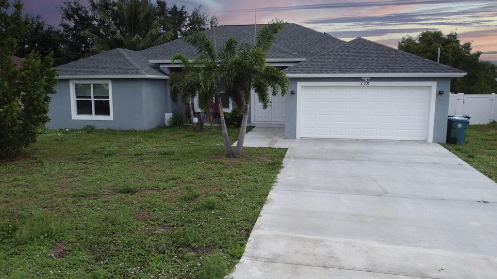 Photo of 115 SW Glenwood Drive, Port Saint Lucie, FL 34984 (MLS # R10997607)