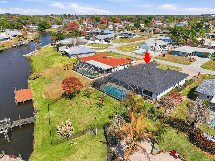 Welcome to your coastal retreat offering desirable ocean access and the perfect setup for enjoying life on the water. This beautifully maintained 3 bedroom 2 bathroom ocean access pool home features a new dock and a 10,000 lb boat lift installed in 2020 making it perfect for boating enthusiasts. The outdoor space is designed for relaxation and entertaining with a pool that was resurfaced in 2025 and a new patio screen creating a private tropical oasis. The backyard has mango and banana trees. Inside the home you will find thoughtful upgrades throughout including new flooring, a stunning kitchen with Thomasville cabinets, new granite countertops, new backsplash and a refreshed primary suite featuring a new master bathroom shower and vanity. You will find peace of mind with major upgrades already completed including impact windows, a new roof installed in 2025, new A/C in 2022 and a new water heater in 2023. Whether you are enjoying sunset cruises, fishing days or poolside weekends, this ocean access home offers the ideal blend of comfort style and waterfront living.