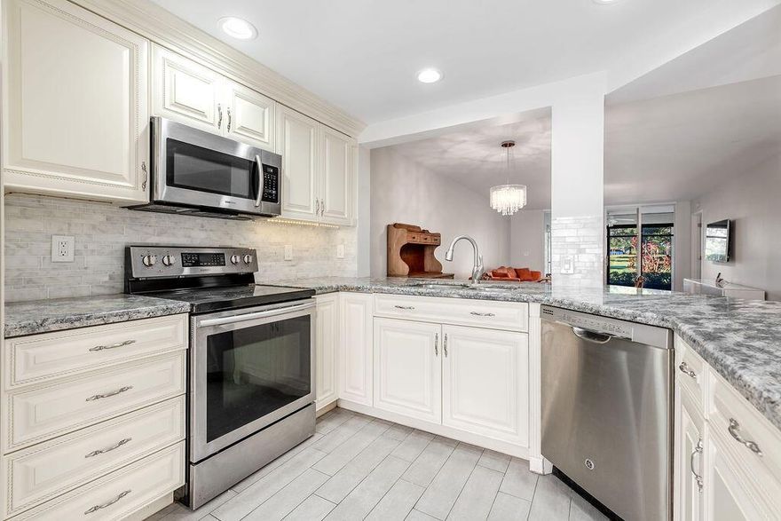 Fantastic opportunity to own one of the most reasonably priced units on the market in the highly sought-after Gleneagles Country Club! This beautifully updated first-floor 2-bedroom, 2-bathroom condo features luxury wood tile flooring throughout, a new water heater, and a spacious open layout with a bright white kitchen designed for both style and functionality. Enjoy stunning golf course views from the comfort of your home while experiencing the resort-style amenities Gleneagles is known for, including two 18-hole championship golf courses, 19 Har-Tru night-lit tennis courts, 8 pickleball courts, 3 restaurants, 2 lounges, card rooms, and a state-of-the-art fitness center--all within this vibrant, all-ages private country club community.