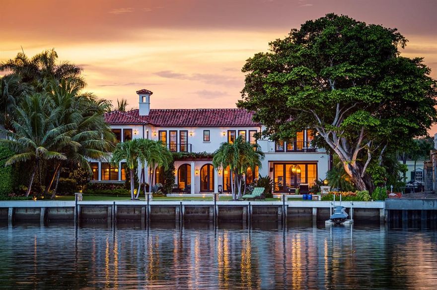 Stunning California-inspired Everglades Island estate. Custom built in 2016. Designed by Roger Janssen with open floor plan, soaring ceilings, beautiful flooring, and gorgeous architectural detailing throughout. Overlooking the Intracoastal with romantic views of the Tarpon Island Bridge. Features 4BR/4.2BA with library, gym, 3 car garage, and expansive club room with pool table, bar, and fireplace. 8,500+/- total square feet with wine cellar, elevator, and smart home system. Living room with stone fireplace leads to formal dining room. Chef's eat-in kitchen opens to waterfront family room. Oversized Master Suite features fireplace, balcony, & beautiful baths. Fantastic outdoor spaces include front gated courtyard with fountains, rear giant banyan tree, fire pit, loggia, pool, spa, & dock. To be sold As Is. All sizes approximate and subject to errors and verification. Sq. Ft. as per county tax rolls.