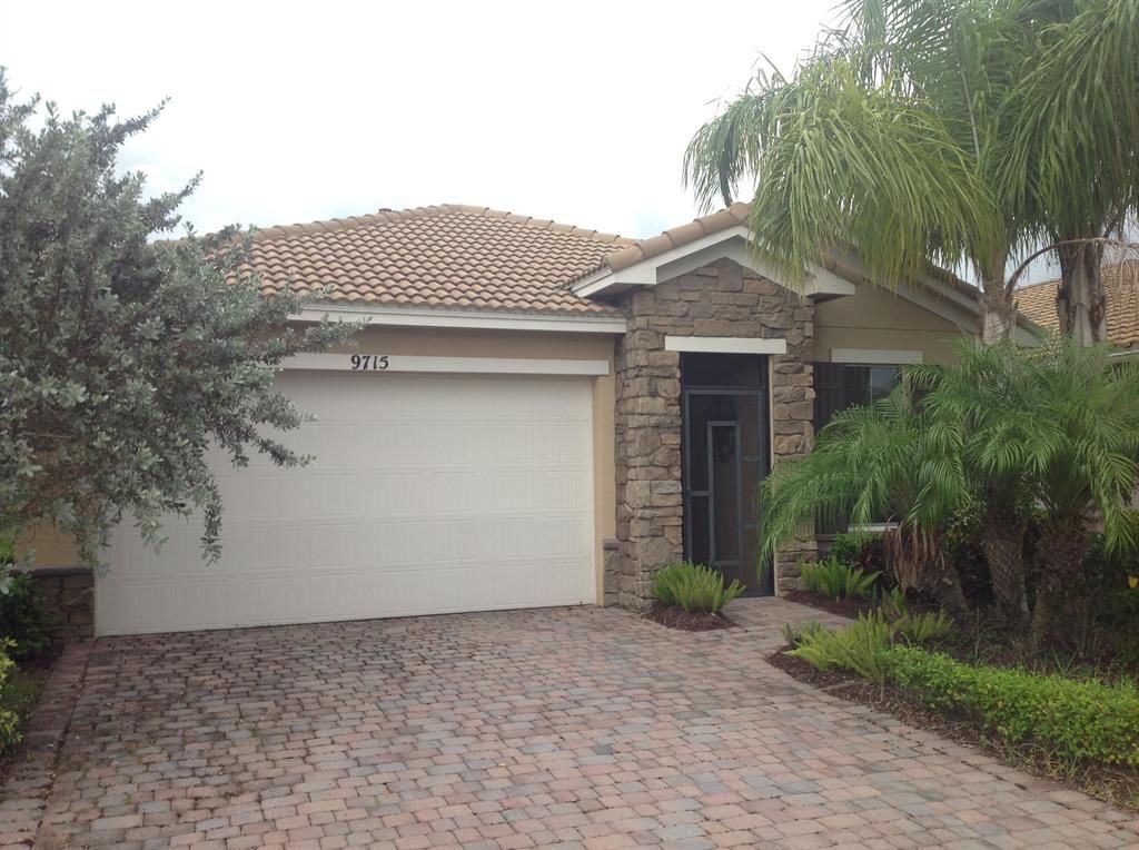 Photo of 9715 SW Royal Poinciana Drive, Port Saint Lucie, FL 34987 (MLS # R10728856)