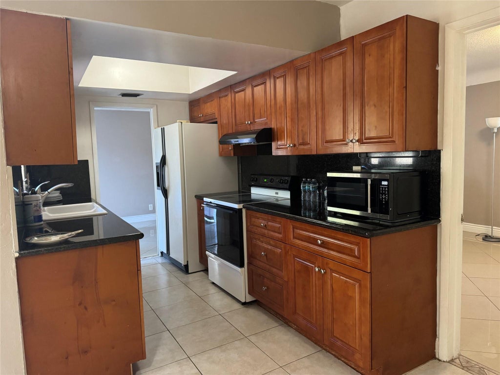 Photo of 5691 SW 1st Street, Plantation, FL 33317 (MLS # B26080620)