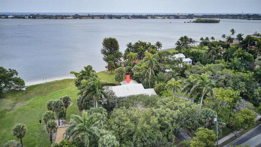 Sensational direct waterfront property in desirable Prospect Park on over a half-acre of land! Private beach and oasis alongside the Intracoastal with ability for a dock to be built. Enjoy Panoramic and Unobstructed views of the Intracoastal and Palm Beach. This non landmarked home and property allows endless opportunities for development and renovation. Colonial Revival home featuring an elegant floor plan including a formal dining room and breathtaking views of the Intracoastal perfect for entertaining. Enjoy water views from the great room, family, kitchen, and game room. The main retreat boasts spectacular views of the Intracoastal and a spacious balcony.