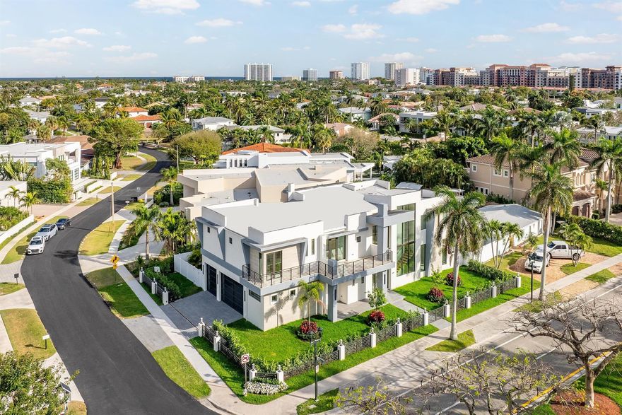 Indulge in the pinnacle of luxury living with this sophisticated contemporary estate.  This exceptional home is nestled in the heart of Boca Raton within the prestigious Boca Villas community. This visionary two-story residence, crafted by the esteemed Yacov Development Group, seamlessly blends modern elegance with timeless charm. As you enter through the magnificent 10 ft glass entry door, prepare to be immersed in a world of refined elegance and meticulous attention to detail. Boasting six bedrooms, each featuring an en-suite bathroom, along with a powder room and full cabana bath, this custom home offers abundant space and convenience. The open concept design creates a seamless flow, ideal for entertaining and comfortable living.