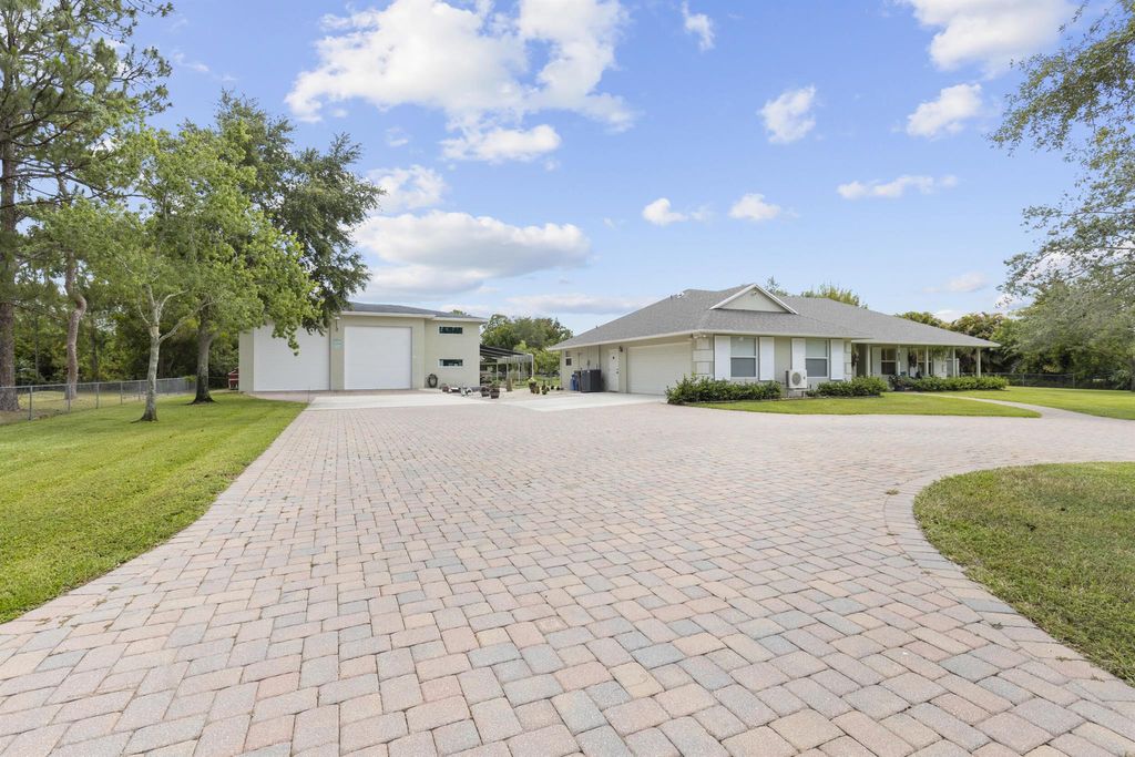 Photo of 14918 Tangelo Boulevard, West Palm Beach, FL 33412 (MLS # R11089623)