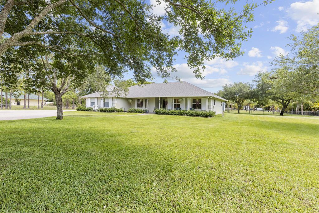 Photo of 14918 Tangelo Boulevard, West Palm Beach, FL 33412 (MLS # R11089623)