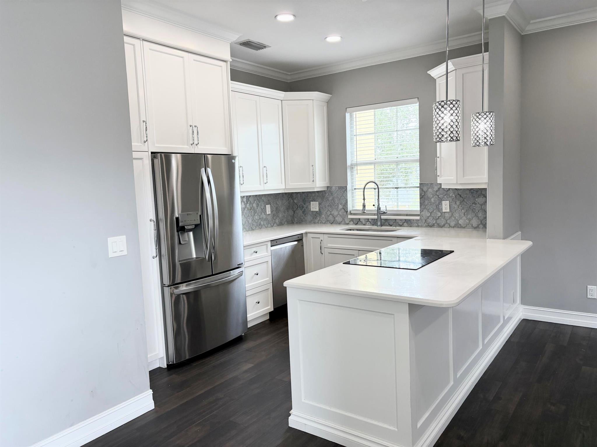 Completely renovated 2/2 with garage in the heart of Tradition. Walking distance to Publix, target, restaurants. Wood floors throughout, quartz in kitchen and bathrooms, SS appliances, upgraded fixtures, custom bathrooms with large soaking tub in master with makeup vanity. Don't miss out on this beautiful condo in Tradition.