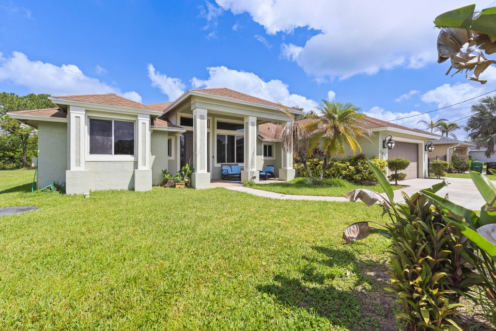 Photo of 5514 NW West Lundy Circle, Port Saint Lucie, FL 34986 (MLS # B26037922)