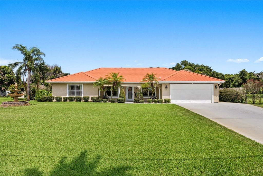Photo of 1819 SE ELROSE Street, Port Saint Lucie, FL 34952 (MLS # B26067986)