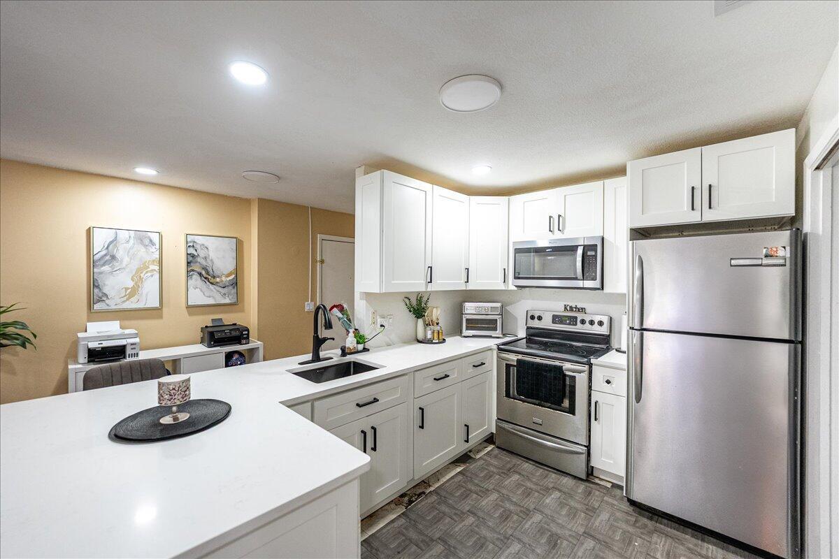 Renovated 2 bedroom, 1.5 bathroom condo in the desirable gated community of Island House. Investor Friendly, No age restrictions and immediate rental potential. HOA includes cable, water, sewer, lawn care, pest control, roof maintenance, exterior insurance, and pool service. Located minutes from shopping, dining, medical facilities, schools, Fort Pierce Inlet, and Atlantic beaches with free parking