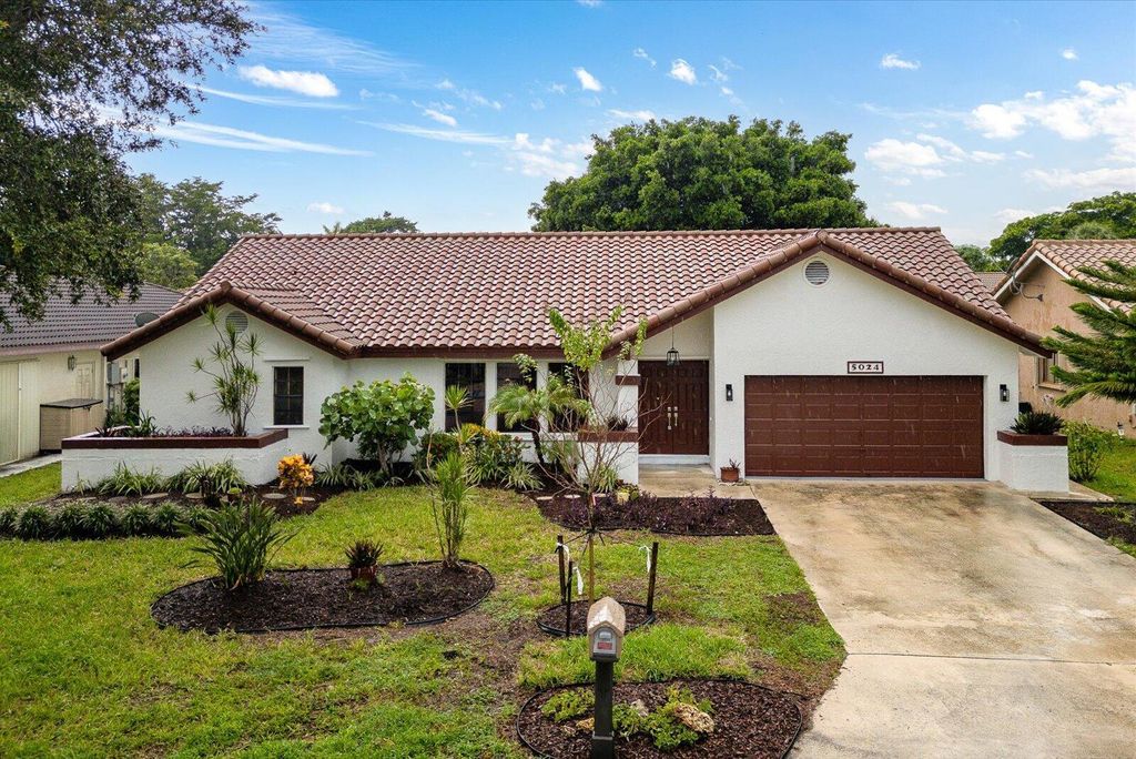 Photo of 5024 NW 58th Terrace, Coral Springs, FL 33067 (MLS # R11121018)