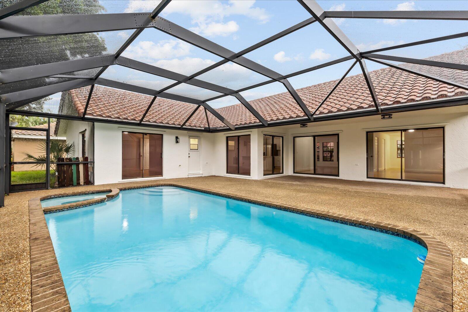 Showings must be scheduled with Showingtime. Stunning 4/2 pool home remodeled in 2025 with gorgeous kitchen and bathrooms! Minutes from town and beaches. Completely move in ready. Offering new Calacatta quartz kitchen with soft close shaker cabinets and high end finishes, spa like tile bathroom with high end vanity, waterproof laminate floors, fresh paint in and out, Brand new appliances, new fixtures and landscaping. Easy access to i95 and shopping. Move in ready condition, you wont need to lift a finger. Low HOA!! Come relax in this gorgeous home and live your Florida Dream!