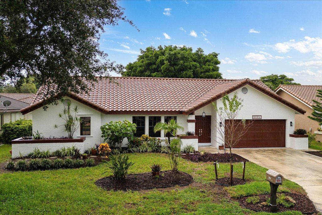 Photo of 5024 NW 58th Terrace, Coral Springs, FL 33067 (MLS # R11121018)