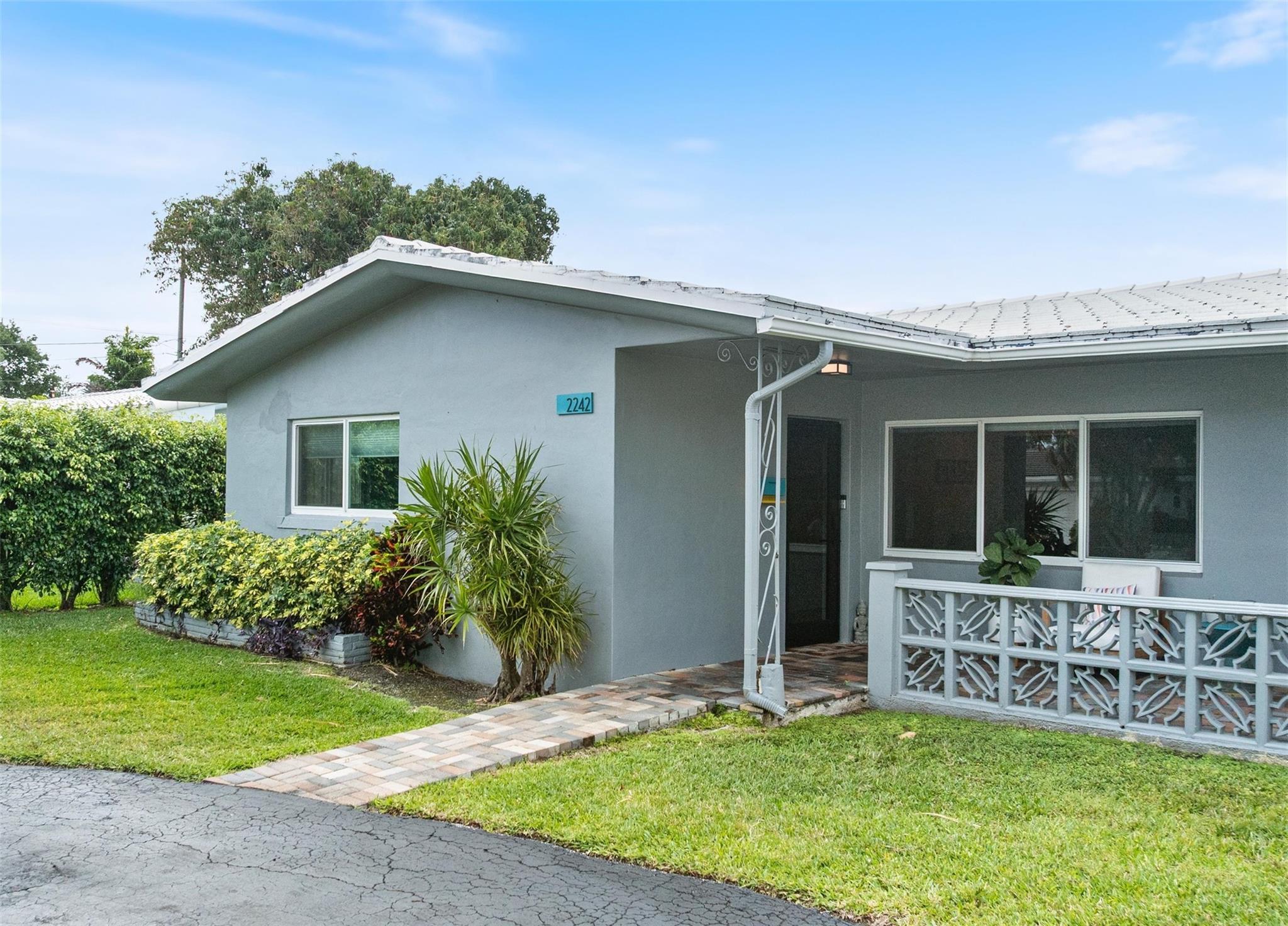 Exclusive opportunity to purchase half a duplex in desired Lighthouse Point. Move-in ready 2 BDs + a den / 2 Baths. Meticulously renovated featuring impact windows & doors, new A/C & water heater. Sleek European kitchen with high-end appliances & quartz countertops. Other features include newly updated bathrooms, updated plumbing, tile flooring throughout & a versatile Florida room perfect as 3rd bedroom, office, or den. Backyard patio can be used for extra parking (3 spaces), since it's adjacent to the back alley. Ideally located within walking distance to restaurants & shopping. No HOA. Great investment opportunity with excellent rental potential! Can be purchased with the other side of the duplex (2240 NE 37th St). Schedule your showing today before this gem is gone!