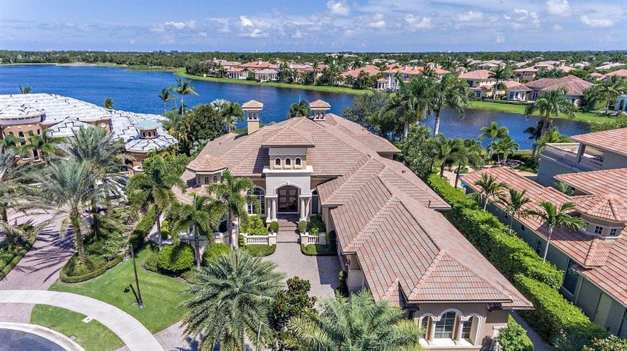 Best view in Mirasol, hands down! SE exposure. Located on a large & private, half an acre cul-de-sac lot, this custom one level estate home offers magnificent long lake views, four bedrooms, six full baths, one 1/2 bath, an office & a theater. Naturally lit, nuetral colors & open floor plan. Grand foyer entry w/ immediate views of the gorgeous water. Marble floors, incredible ceiling detail & crown moldings throughout. Kitchen offers top of the line appliances, center island w/sink, 6-top gas stove/oven & built in desk. Master Suite perfectly appointed w/sitting area for the stunning views, his/her baths & a wet bar. Spectacular outdoor living area boasts expansive water views, infinity pool, spa, & summer kitchen. Impact glass, 4 car garage, golf membership.