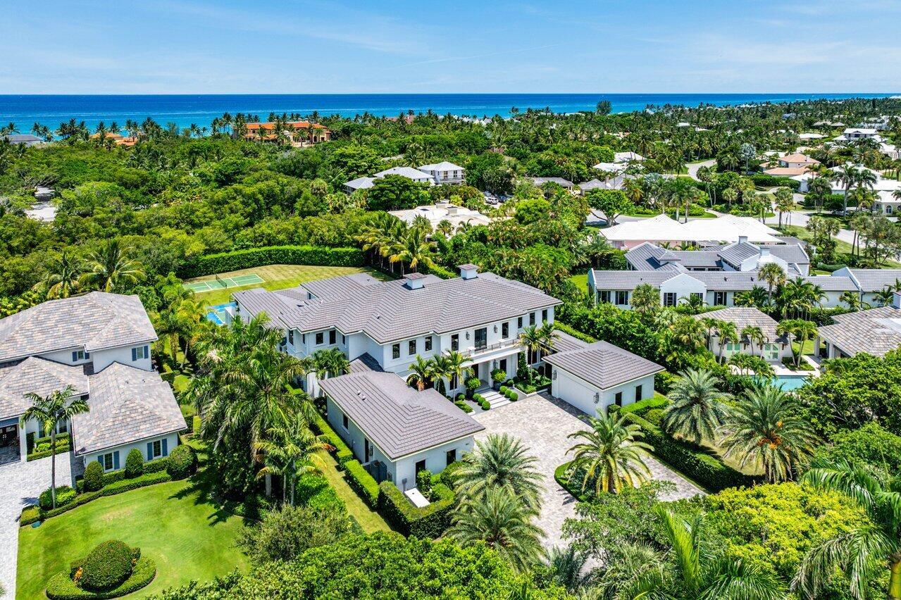 A one-of-a-kind masterpiece in prestigious Seminole Landing, this ultra-custom estate blends timeless elegance with modern innovation. Completed in 2020 with an unwavering commitment to quality, the home delivers an unparalleled living experience just minutes from Seminole golf course, other championship golf courses and private beach access.Set on over an acre at the end of a tranquil cul-de-sac, the residence is enveloped by lush tropical landscaping and towering privacy fences that ensure a secure retreat. Approximately 70% of the interior is finished in hand-applied Venetian plaster, a striking complement to the sophisticated Crestron automation system, Sonos audio throughout, and comprehensive Lutron lighting and motorized blinds.