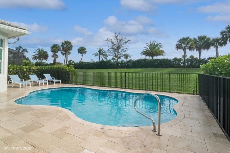 DESIRABLE TROPEA model features a spacious and modern great room floor plan with three bedrooms, 2 are equipped with their own en-suite bathroom, providing maximum comfort and privacy. The house is designed with a contemporary touch, boasting numerous upgrades that enhance both functionality and aesthetics. The kitchen has it all including a huge center island covered in beautiful quartz with plenty of room for extra seating. Upgraded white shaker cabinets offer tons of storage space. Large living room with adjacent formal dining area and breakfast nook leads out to covered lanai that offers a shaded area so you can appreciate the outdoor space regardless of the weather. For the sun lovers a refreshing open-air pool surrounded by travertine patio adds a luxurious and recreational element