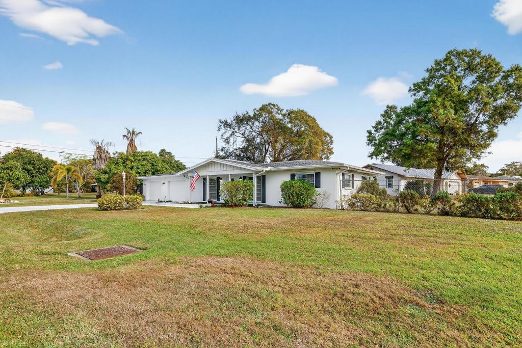 Photo of 501 NE Oleander Avenue, Port Saint Lucie, FL 34952 (MLS # R11152844)