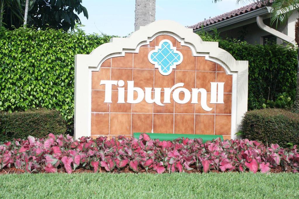 Tiburon II is Boca's best kept secret. This 2 bedroom, 2 bath home features eat in kitchen with granite countertops and wood cabinets. Access the Florida room from either the living room, or master bedroom. Vaulted ceilings, tile and laminate flooring. Lush landscaped fenced in back patio. Canal sits beyond the yard. Garage has been modified to include a small office/workspace. New microwave and oven 2021. A/C replaced in 2015. Roof replaced in 2010. Hot water heater replaced 2020. Accordion hurricane shutters.Accessible to restaurants and shopping.