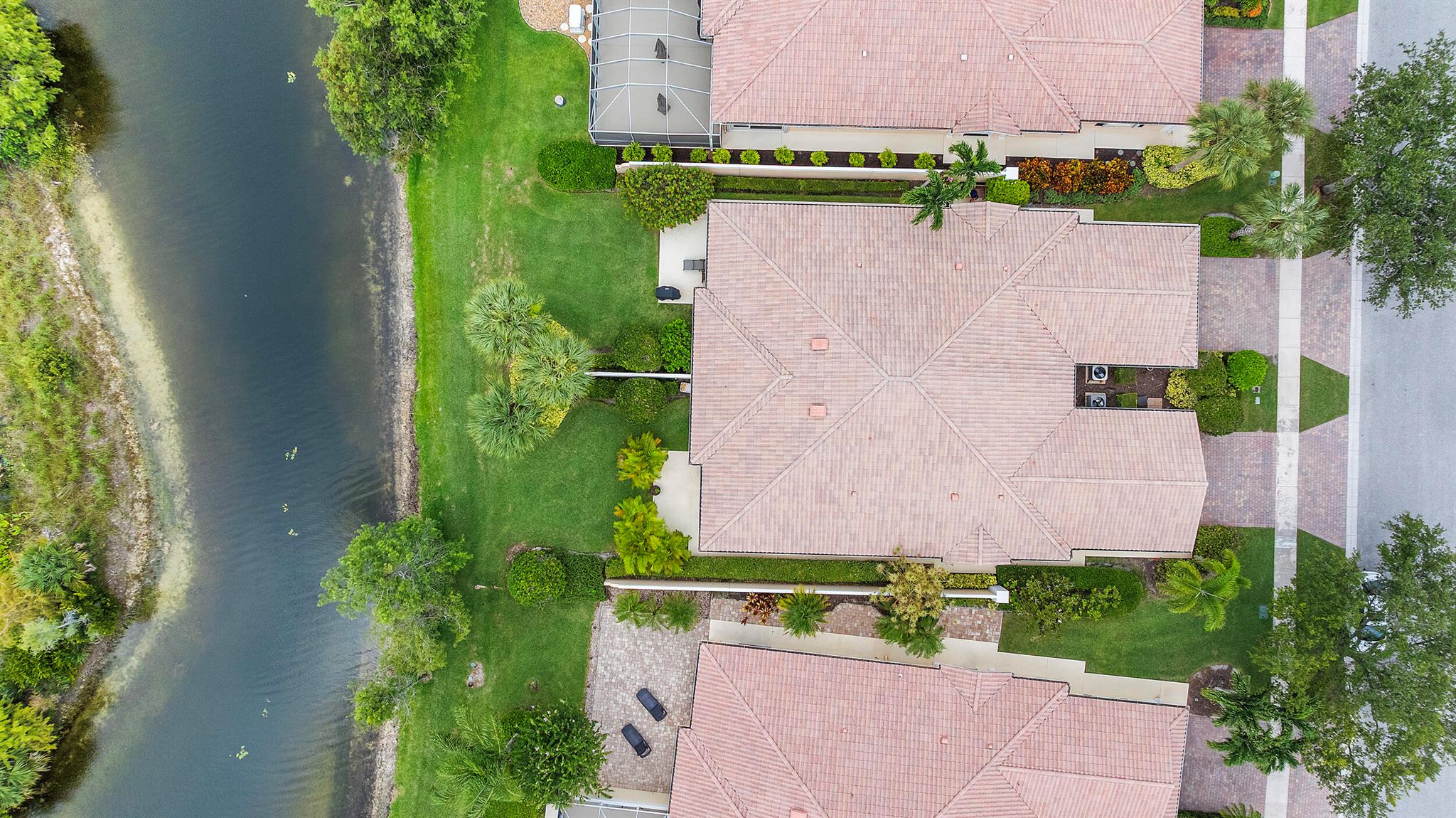 Beautiful Capri villa right on the preserve! This 2/2, split floor plan, with a two-car garage features total impact glass, updated kitchen, bathrooms and floors! BRAND-NEW A/C!! Plantation shutters on all of the windows! Central vac, separate laundry room with newer washer and dryer! Screened-in patio AND a yard right on the water! New owners can lease right away, one time/year not less than four months. The amenities are endless! Featuring a cafe, salon, post office, fitness center, dog groomer, library. Resort-style pool, separate lap pool, six tennis courts, pickleball, basketball, bocce, and scenic walking trails throughout the lakes and preserve! With 24-hour manned security, ALL AGES WELCOME!!!
