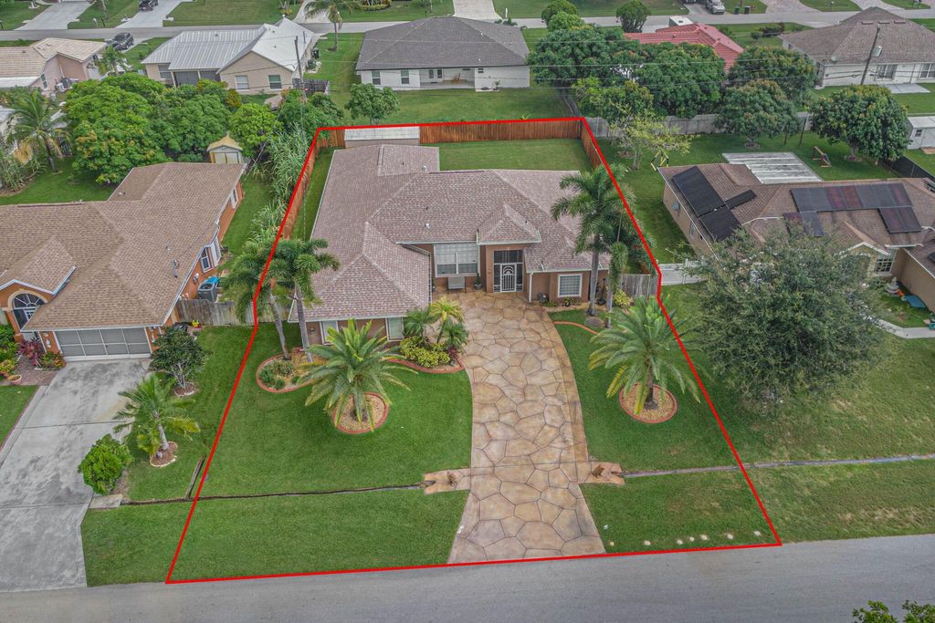 Photo of 5495 NW Evanston Avenue, Port Saint Lucie, FL 34983 (MLS # R11004175)