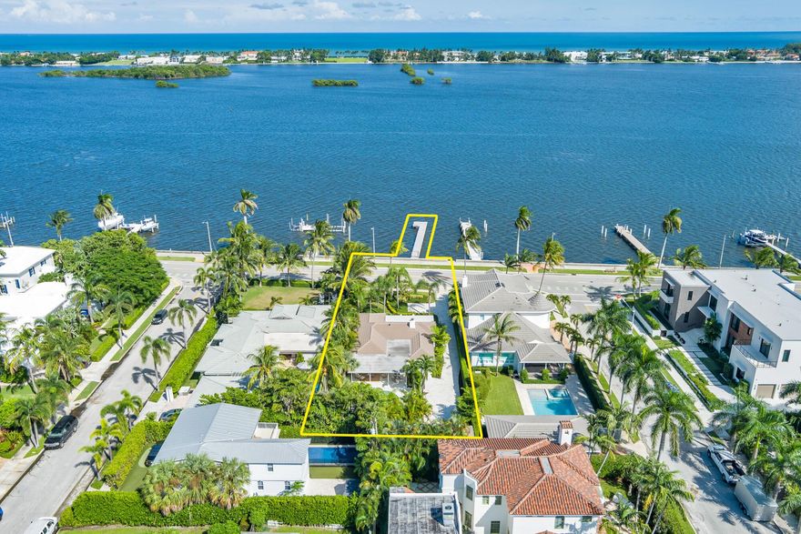 OWNER FINANCING AVAILABLE. Step into waterfront living at its finest with this pristine Flagler Drive waterfront home. Enjoy breathtaking Intracoastal views and over 62 feet of waterfront on this approx 9800 sqft lot.  A 100-foot private dock makes this a boater's dream--just bring your boat and start cruising. Inside the main house you'll find 3 bedrooms, 2.5 baths, plus a bonus 1/1 separate guest accommodations, all wrapped in full hurricane impact windows and doors. Clean architectural lines are balanced with custom millwork and molding, giving the home a timeless elegance.  The newer roof, new HVAC, new appliances and thoughtful updates make this residence completely turnkey. Surrounded by lush, tropical landscaping, and a resort style heated pool and covered loggia, this