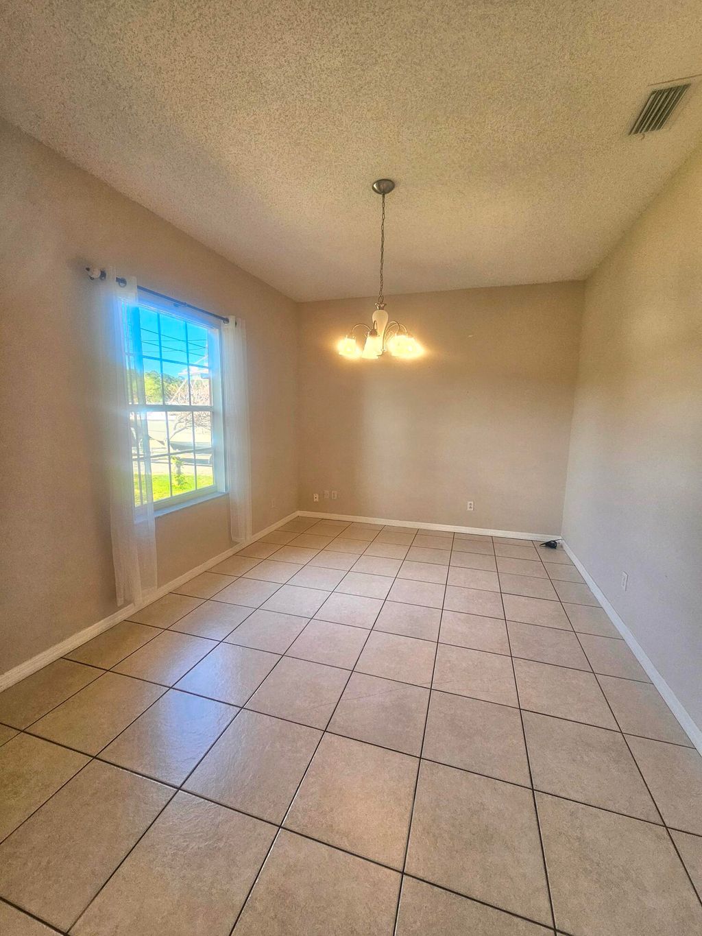 Photo of 1852 SW Janette Avenue, Port Saint Lucie, FL 34953 (MLS # B26025292)
