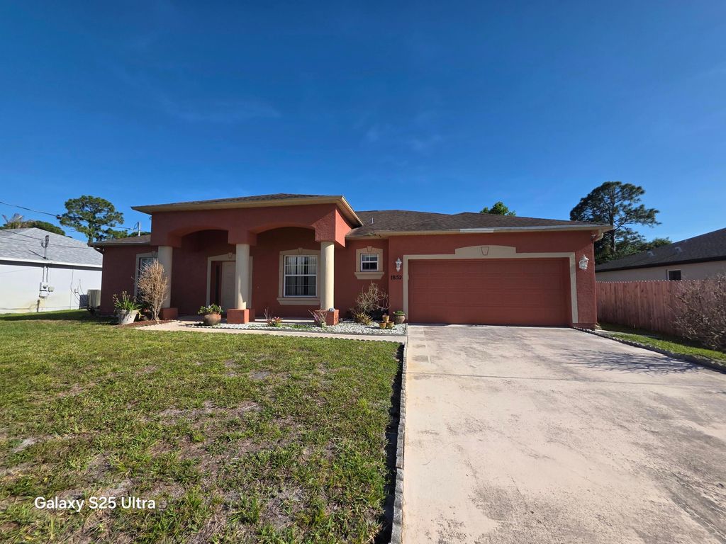 Photo of 1852 SW Janette Avenue, Port Saint Lucie, FL 34953 (MLS # B26025292)