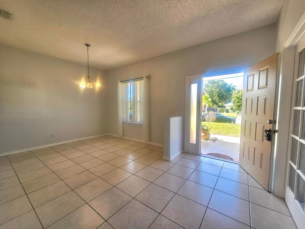 Photo of 1852 SW Janette Avenue, Port Saint Lucie, FL 34953 (MLS # B26025292)