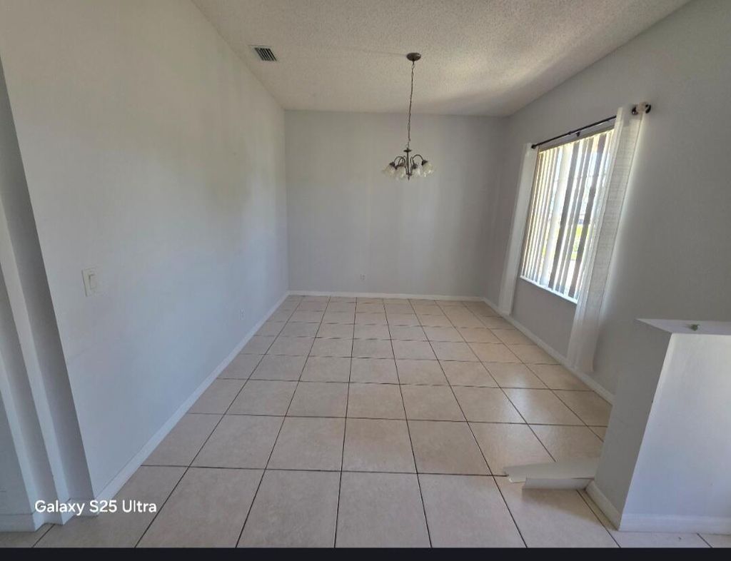 Photo of 1852 SW Janette Avenue, Port Saint Lucie, FL 34953 (MLS # B26025292)