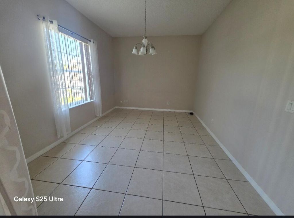 Photo of 1852 SW Janette Avenue, Port Saint Lucie, FL 34953 (MLS # B26025292)
