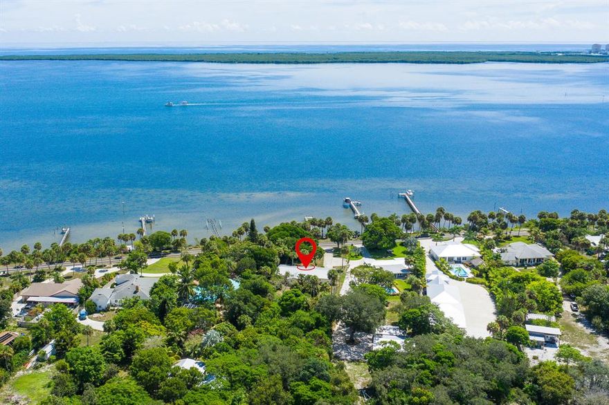 Great opportunity to own an Intracoastal Waterway access home with a private dock in the scenic route of Indian River known for fantastic fishing and boating. Home is conveniently located less than 5 miles from shopping, restaurants, schools and other supporting amenities. Beautiful beach and Treasure Coast International Airport are within 12 miles. Quality built home was remodeled in 1996. HVAC replaced 8/2018. It features Insulated floor-to-ceiling Picture Windows, Fireplace; Spruce Wood Flooring; custom crown moldings, baseboards & casing; chair rail and wainscoting; Cedar closets in master and guest bedrooms; tongue and groove Cypress wood ceiling in many rooms; solid Pine panel doors for most interior doors; recess lighting throughout the house. Please call for your private viewing.