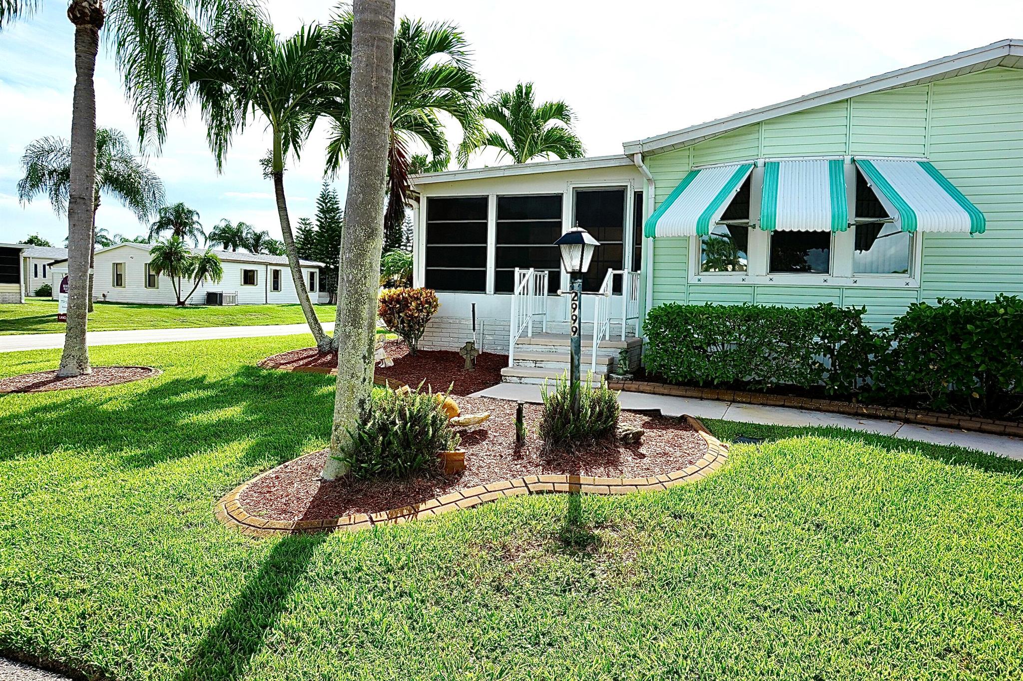Move right in this turn key land-owned home. Just bring your toothbrush. Corner lot. New roof 2023, new AC 2024. Three sheds for storage. Enclosed lanai. Storm shutters. Property is perfect for the seasonal person/s who want to start enjoying all the amenities Savanna Club has to offer: 3 pools, tennis & pickleball courts, shuffleboard, bocce ball, billiards, gyms, theatre, restaurant, libraries, and a number of social clubs. The list goes on!