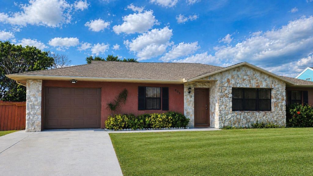 Photo of 805 SE Cavern Avenue, Port Saint Lucie, FL 34983 (MLS # B26024195)