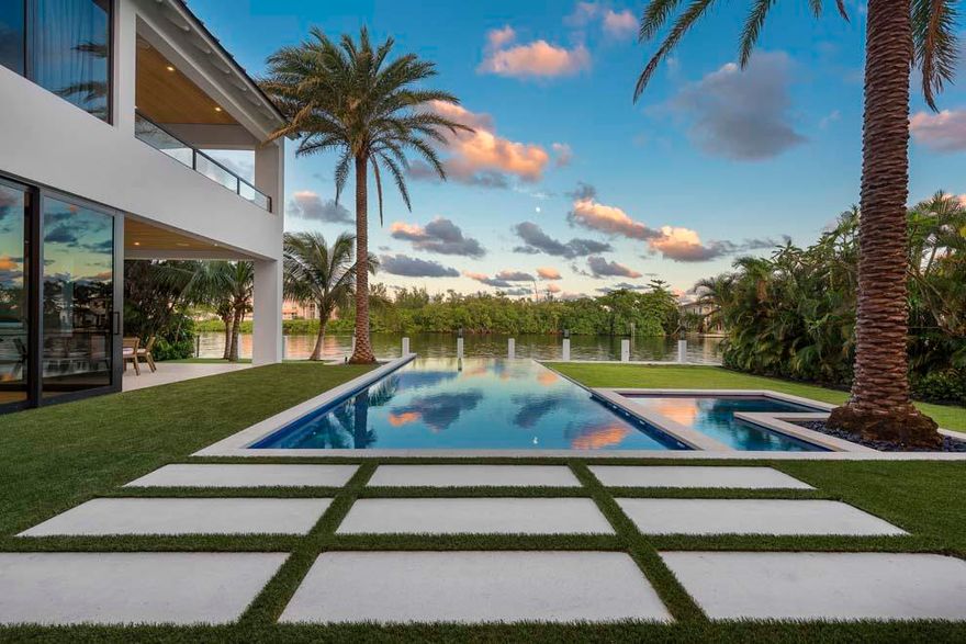 This Coastal Contemporary Waterfront Estate is located on a half-acre lot along the Intracoastal Waterway in the heart of East Delray Beach. Situated in the highly desirable Palm Trail neighborhood, the property measures 100 feet of width by 200 feet of depth making it one of the largest properties in East Delray. The rear of the estate faces east and overlooks a four-acre nature preserve, providing an unparalleled degree of serenity and privacy. Boaters will appreciate the brand new 80-foot concrete dock and no-wake zone, which allows convenient and secure dockage in your backyard. Voyages to the ocean are easy Boynton Beach and Boca Raton Inlets nearby. Furnished by Leighton Design Group, the residence features some of the finest finishes and attention to detail the industry offers.