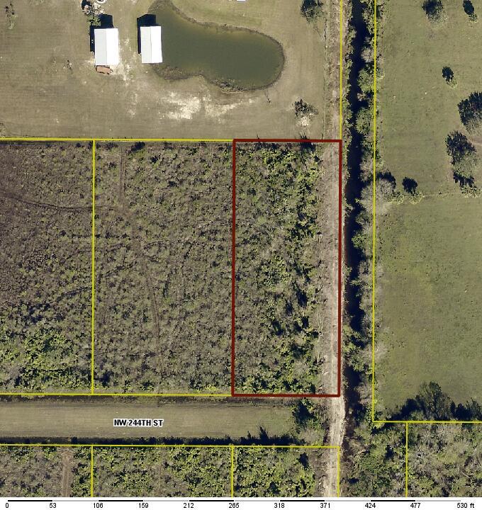 Beautiful vacant land on the end of a peaceful street. This corner lot is up against a canal and provides a sense of peace and tranquility, Located in the southwest portion of the Viking Estate/ Prairie. This lot has beautiful tall trees throughout. Owner Financing Available.